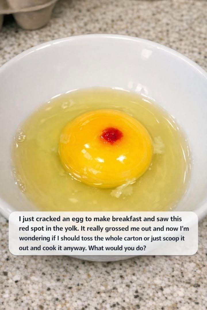 I just cracked an egg to make breakfast and saw this red spot in the yolk. It really grossed me out and now I’m wondering if I should toss the whole c.